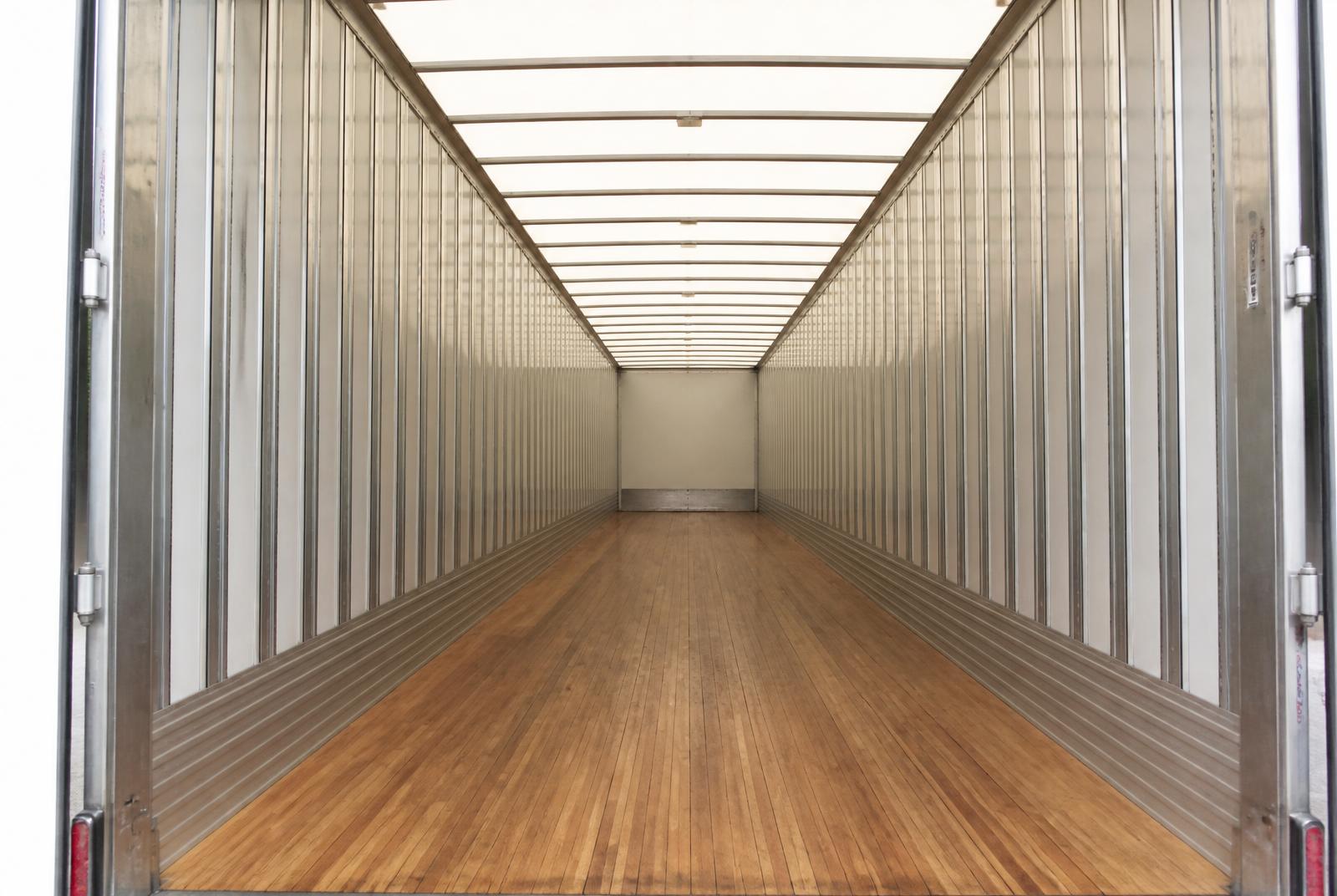Interior of a clean Ford Storage 53-foot storage trailer with oak plank flooring